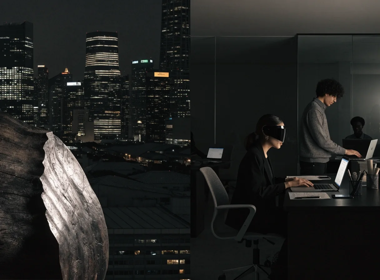 Hands on a dark keyboard beside a cable run on a studio desk at night